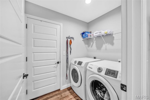1103 Baseball Dr, Foristell, MO 63348 - laundry room with independent washer and dryer and wood finished floors