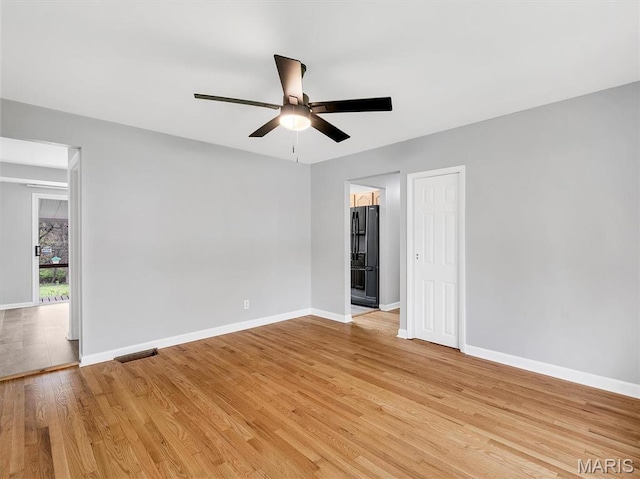 3100 Edgemont Ct, Saint Ann, MO 63074 - spare room with light wood finished floors, ceiling fan, and baseboards