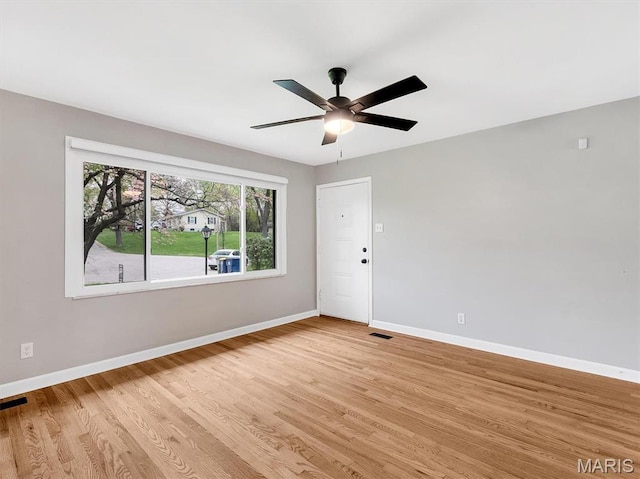 3100 Edgemont Ct, Saint Ann, MO 63074 - unfurnished room featuring light wood-style flooring, baseboards, and a ceiling fan