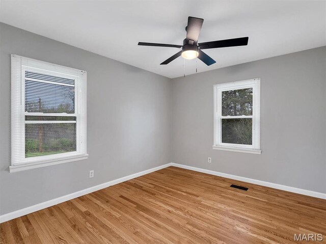 3100 Edgemont Ct, Saint Ann, MO 63074 - unfurnished room featuring baseboards, light wood-style flooring, and a ceiling fan