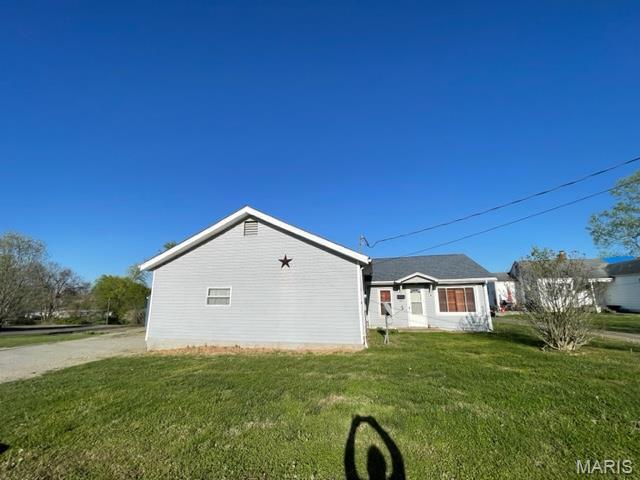 515 S Main St, Fredericktown, MO 63645 - view of home's exterior featuring a yard