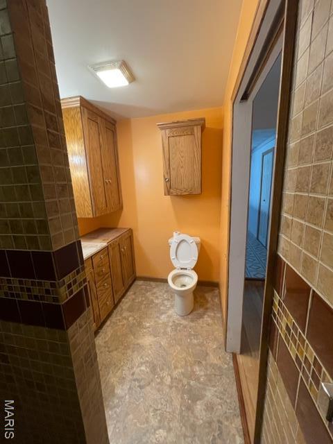 515 S Main St, Fredericktown, MO 63645 - bathroom featuring toilet and baseboards