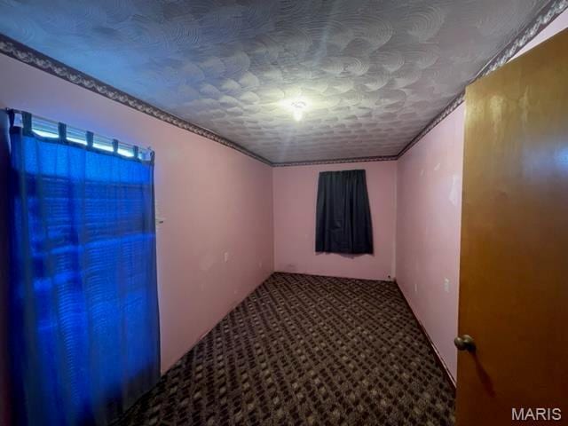 515 S Main St, Fredericktown, MO 63645 - carpeted empty room with crown molding