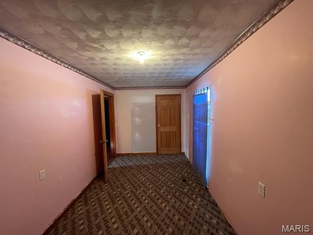 515 S Main St, Fredericktown, MO 63645 - hallway featuring carpet floors, crown molding, and a textured ceiling