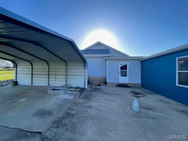 515 S Main St, Fredericktown, MO 63645 - garage featuring a detached carport