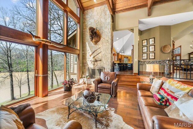 16480 Walnut Rail Rd, Chesterfield, MO 63005 - living area with high vaulted ceiling, hardwood / wood-style flooring, beam ceiling, a fireplace, and wood ceiling