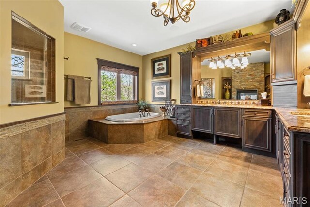 16480 Walnut Rail Rd, Chesterfield, MO 63005 - full bath with a bath, vanity, a chandelier, and tile patterned floors