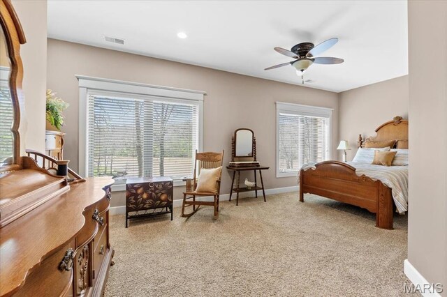 16480 Walnut Rail Rd, Chesterfield, MO 63005 - bedroom with multiple windows, light colored carpet, baseboards, and a ceiling fan