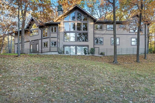 16480 Walnut Rail Rd, Chesterfield, MO 63005 - back of house with a yard and a chimney