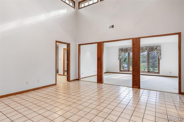 3581 Jarvis Rd, Hillsboro, MO 63050 - unfurnished room featuring a towering ceiling, baseboards, and light tile patterned floors
