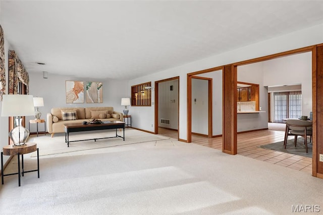 3581 Jarvis Rd, Hillsboro, MO 63050 - tiled living room featuring carpet and baseboards