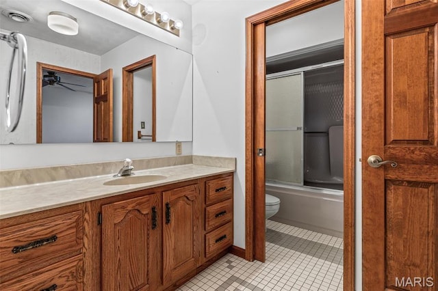 3581 Jarvis Rd, Hillsboro, MO 63050 - bathroom with ceiling fan, toilet, vanity, tile patterned flooring, and enclosed tub / shower combo