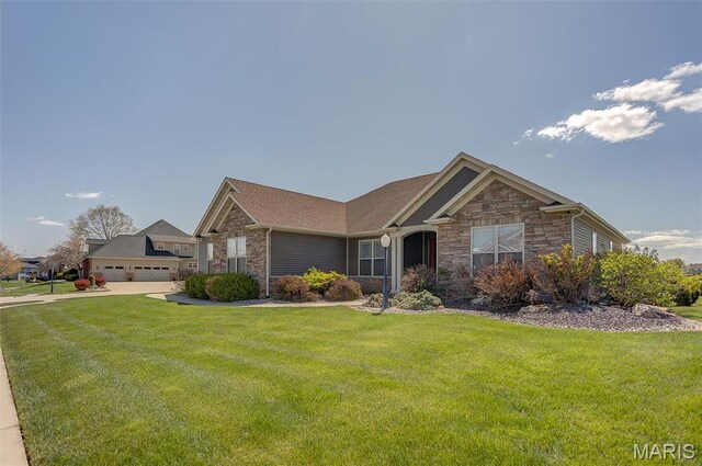 7048 Alston Ct, Edwardsville, IL 62025 - ranch-style home featuring stone siding, a front yard, and a garage
