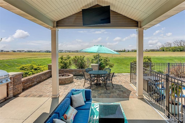 7048 Alston Ct, Edwardsville, IL 62025 - view of patio / terrace with a fire pit, a view of countryside, and an outdoor kitchen
