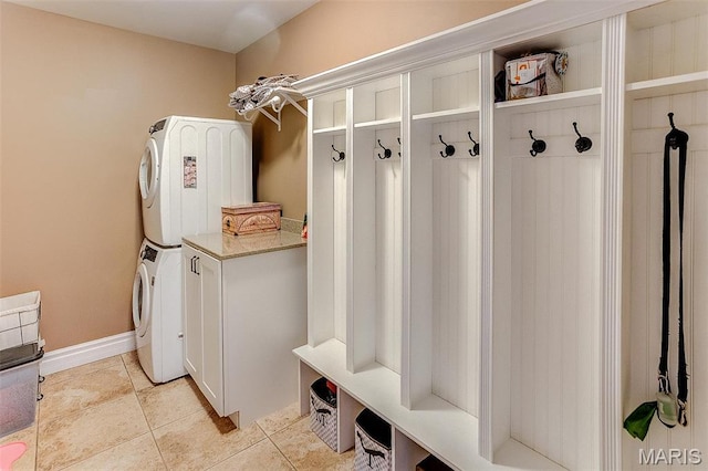 7048 Alston Ct, Edwardsville, IL 62025 - mudroom featuring estacked washer and dryer and light tile patterned flooring