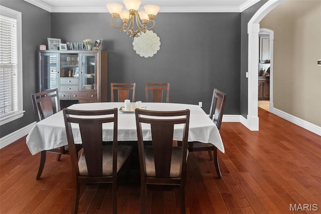 7048 Alston Ct, Edwardsville, IL 62025 - dining space with a chandelier, baseboards, plenty of natural light, dark wood finished floors, and crown molding