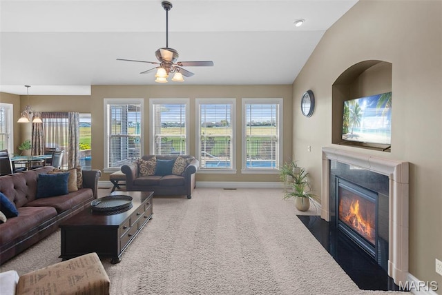 7048 Alston Ct, Edwardsville, IL 62025 - living area featuring a high end fireplace, ceiling fan, carpet flooring, baseboards, and lofted ceiling