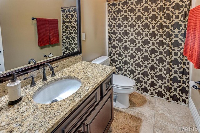 7048 Alston Ct, Edwardsville, IL 62025 - full bathroom featuring toilet, vanity, tile patterned flooring, and a shower with curtain