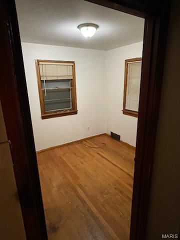 110 Barto Dr, Saint Louis, MO 63135 - empty room with wood finished floors