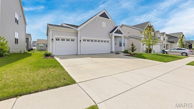 view of front facade with an attached garage, a front yard, concrete driveway, and a residential view