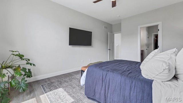bedroom with wood finished floors, baseboards, and a ceiling fan