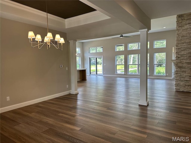 11906 Santino Ct, Creve Coeur, MO 63141 - unfurnished dining area with decorative columns, plenty of natural light, a raised ceiling, baseboards, and crown molding