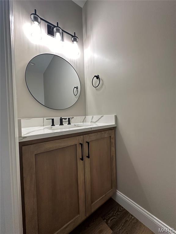 11906 Santino Ct, Creve Coeur, MO 63141 - bathroom with baseboards and vanity
