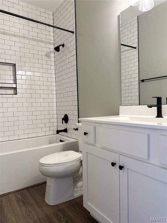 11906 Santino Ct, Creve Coeur, MO 63141 - bathroom featuring toilet, wood finished floors, shower / tub combination, and vanity