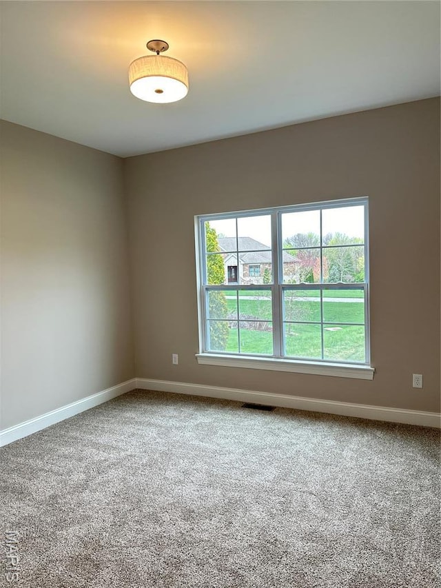 11906 Santino Ct, Creve Coeur, MO 63141 - unfurnished room featuring carpet floors, baseboards, and plenty of natural light