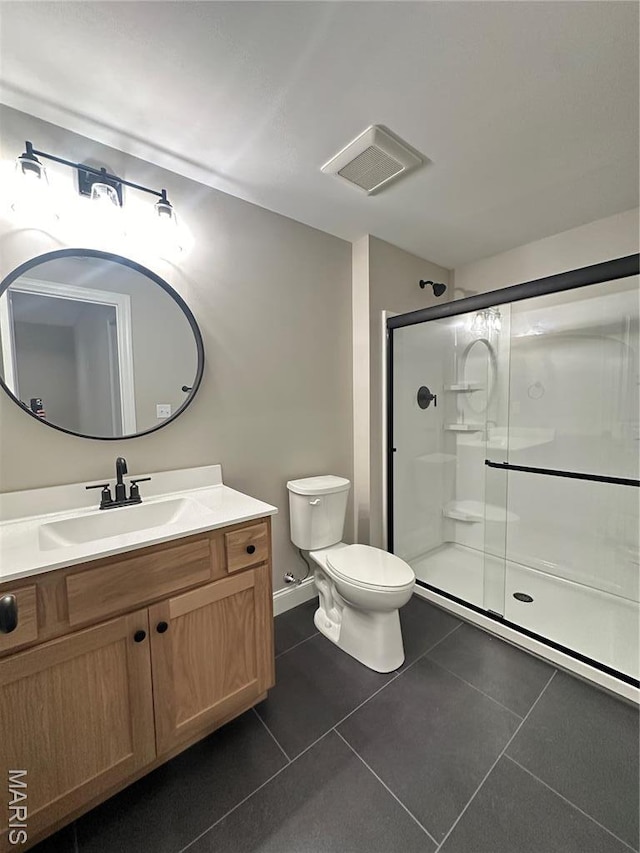 11906 Santino Ct, Creve Coeur, MO 63141 - full bathroom featuring toilet, a stall shower, tile patterned floors, and vanity
