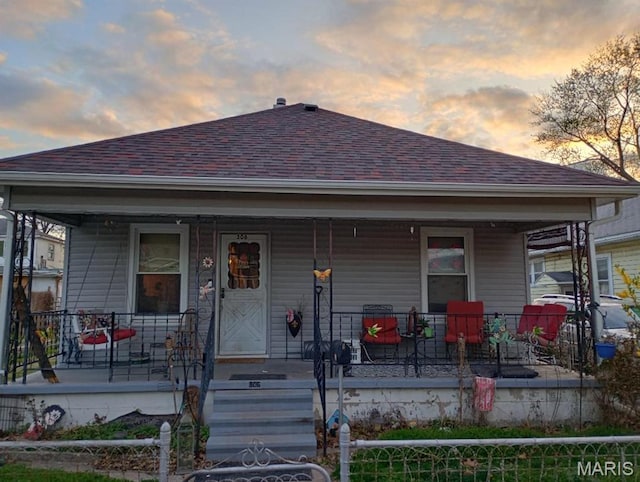 306 Kingshighway, East Alton, IL 62024 - view of front facade featuring a porch and roof with shingles