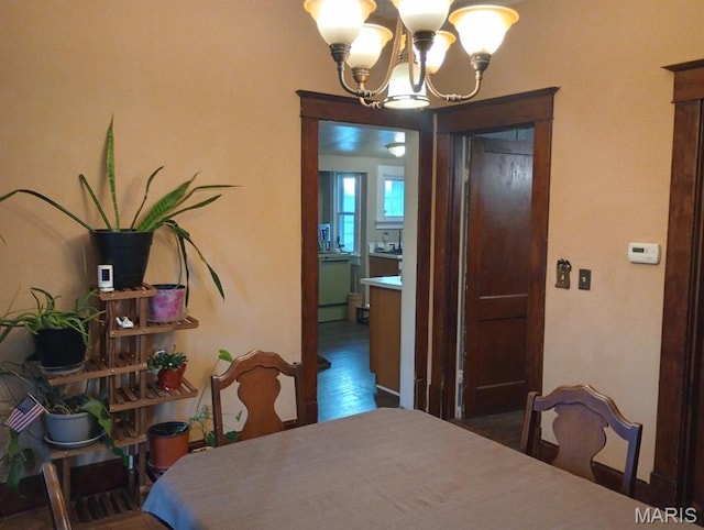306 Kingshighway, East Alton, IL 62024 - dining room featuring a chandelier and wood finished floors