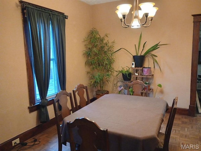 306 Kingshighway, East Alton, IL 62024 - dining area with a chandelier and baseboards