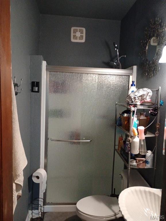 306 Kingshighway, East Alton, IL 62024 - bathroom with a stall shower, toilet, and a sink
