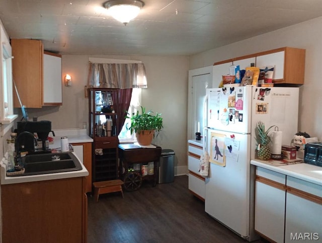 306 Kingshighway, East Alton, IL 62024 - kitchen with a sink, dark wood-style flooring, light countertops, and freestanding refrigerator