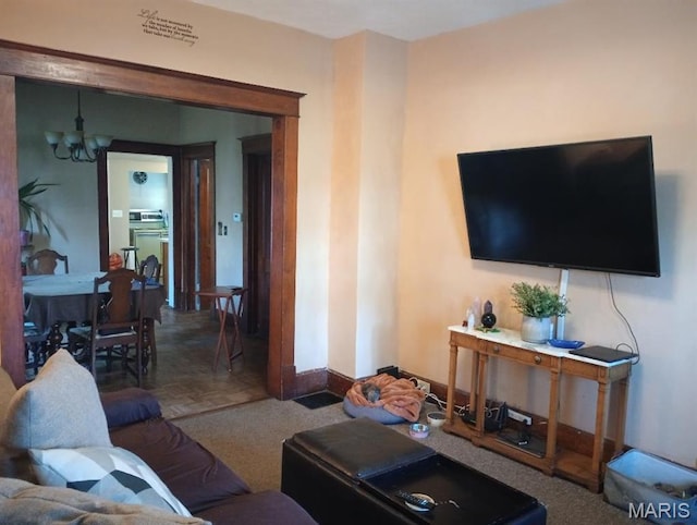 306 Kingshighway, East Alton, IL 62024 - living room featuring a chandelier and baseboards