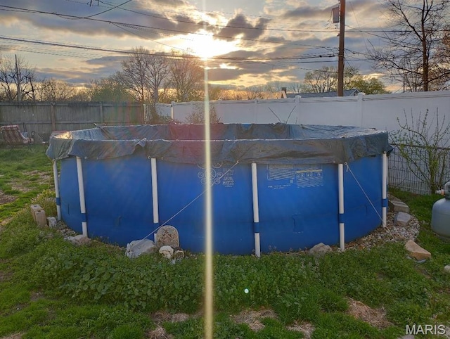 306 Kingshighway, East Alton, IL 62024 - outdoor structure at dusk with a fenced backyard