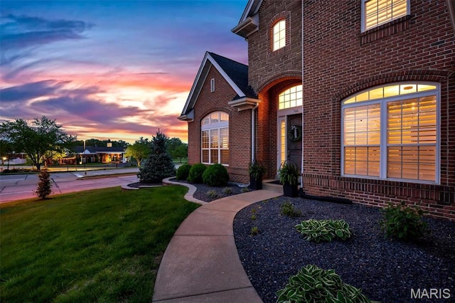 500 Overlook Terrace Court, Eureka, MO 63025 - exterior entry at dusk featuring brick siding and a yard