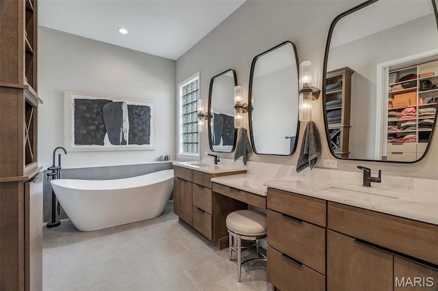 500 Overlook Terrace Court, Eureka, MO 63025 - bathroom with a freestanding bath, vanity, tile patterned flooring, and a walk in closet