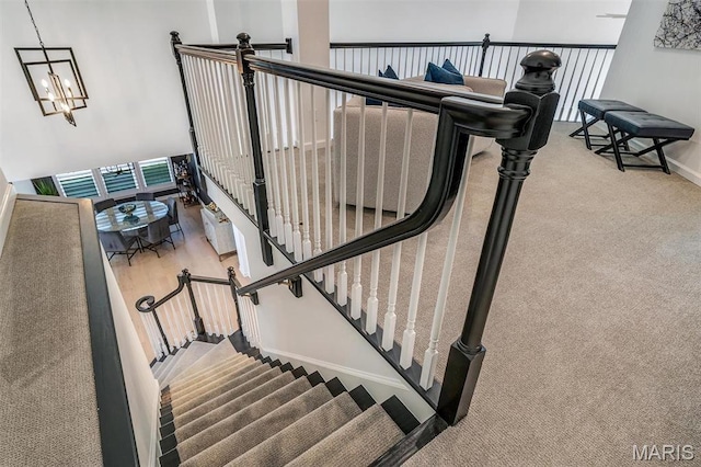 500 Overlook Terrace Court, Eureka, MO 63025 - stairway with baseboards, carpet, and a chandelier