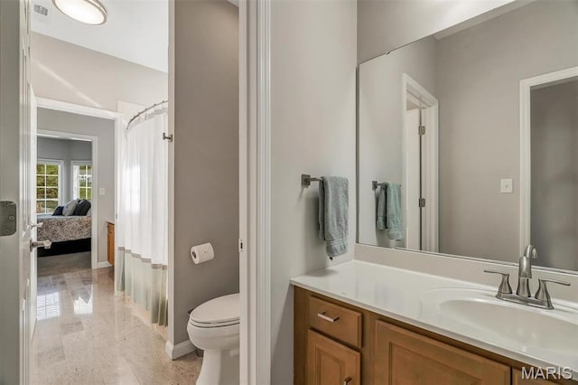 500 Overlook Terrace Court, Eureka, MO 63025 - full bathroom with baseboards, vanity, toilet, ensuite bathroom, and a shower with curtain