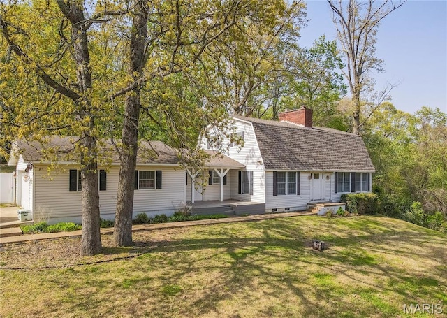 16747 Chalk Bluff Trl, Dexter, MO 63841 - view of front of home with a front lawn, a gambrel roof, and a chimney