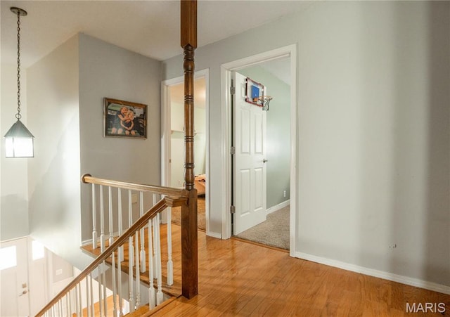 16747 Chalk Bluff Trl, Dexter, MO 63841 - hall with an upstairs landing, wood finished floors, and baseboards