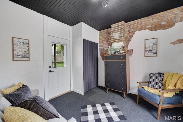 sitting room with dark colored carpet