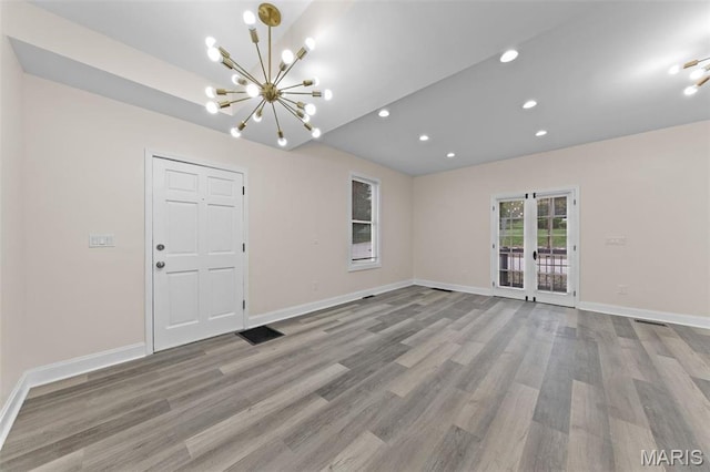 236 Georgia Ave, Saint Louis, MO 63135 - empty room with a chandelier, light wood-style flooring, baseboards, and recessed lighting