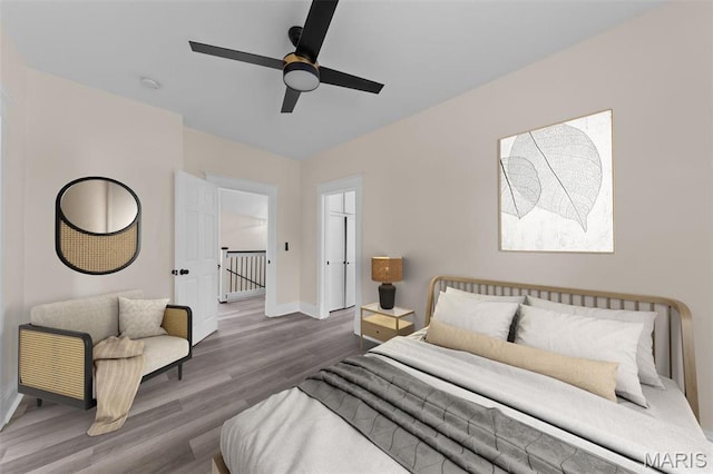 236 Georgia Ave, Saint Louis, MO 63135 - bedroom with baseboards, wood finished floors, and a ceiling fan