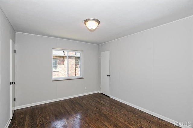 7219 Dartmouth Ave, Saint Louis, MO 63130 - spare room with wood finished floors, baseboards, and ornamental molding