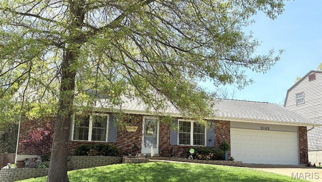 2142 Catlin Ct, Barnhart, MO 63012 - view of front facade featuring a garage, brick siding, a front yard, and concrete driveway