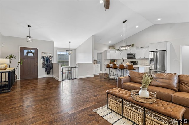105 Shepherd Mountain Rd, Farmington, MO 63640 - living area featuring dark wood-style floors, a chandelier, high vaulted ceiling, and recessed lighting