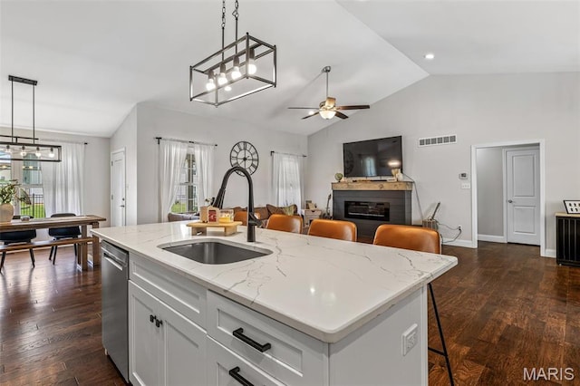 105 Shepherd Mountain Rd, Farmington, MO 63640 - kitchen with a sink, a ceiling fan, lofted ceiling, a glass covered fireplace, and decorative light fixtures